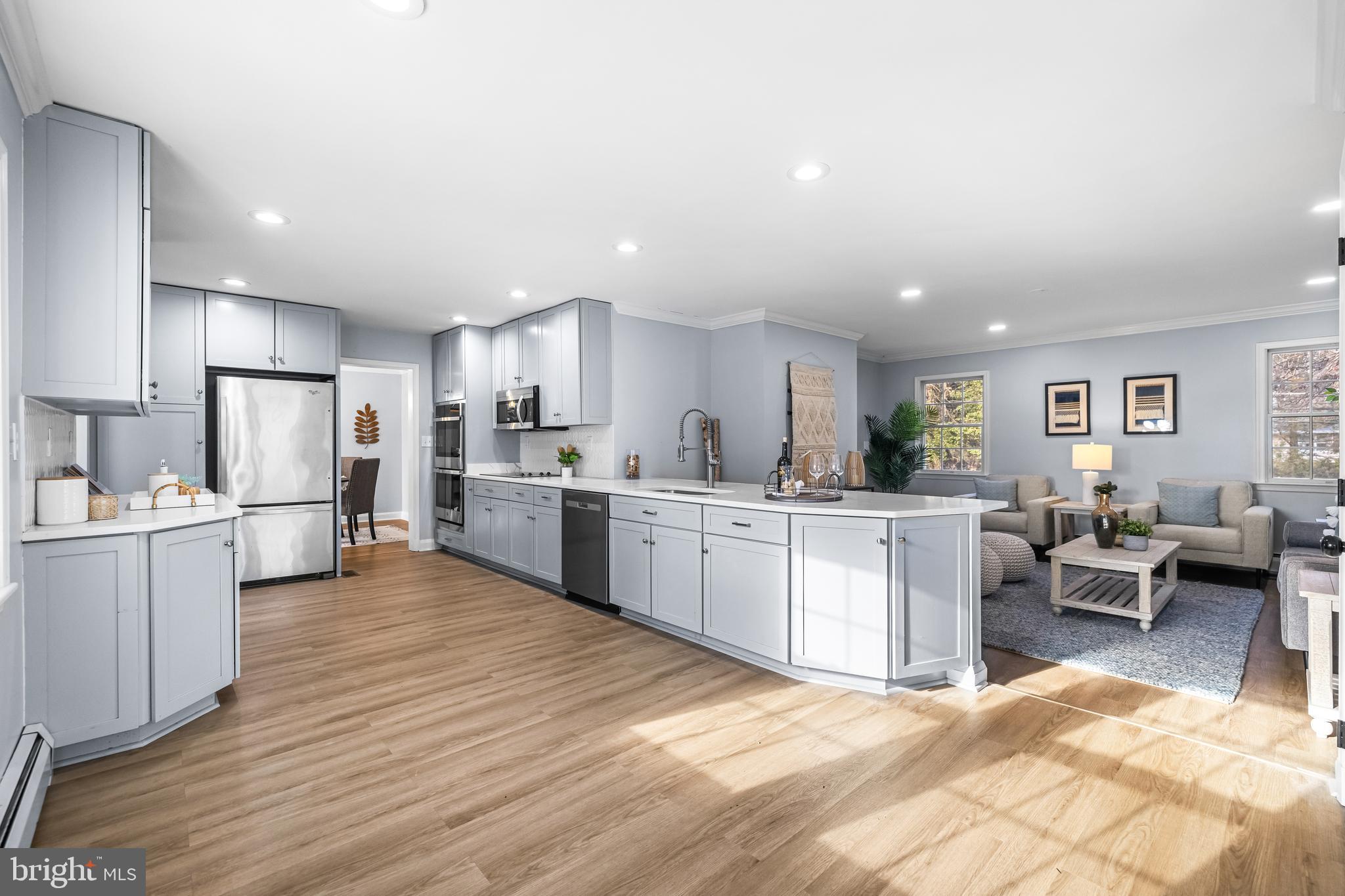3533 Stansbury Mill Road Phoenix, MD 21131 - Photo 14 of 47 a large white kitchen with lots of counter space sink and cabinets