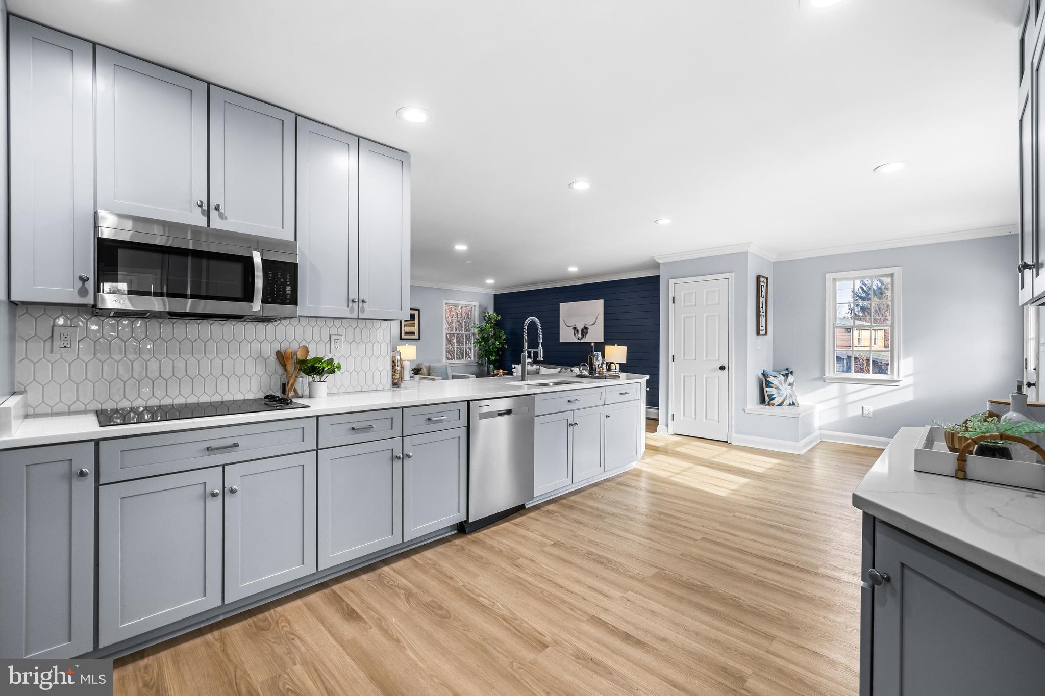 3533 Stansbury Mill Road Phoenix, MD 21131 - Photo 15 of 47 a kitchen with a sink cabinets and microwave