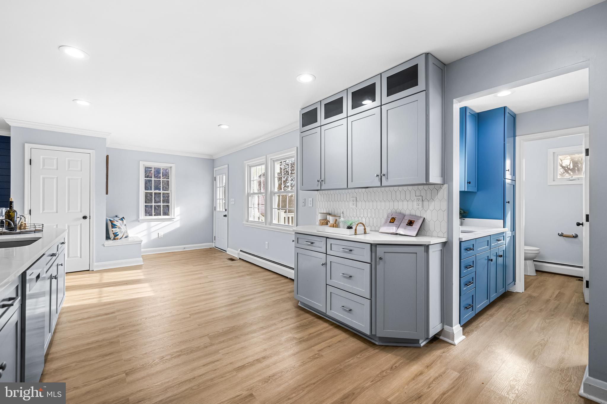 3533 Stansbury Mill Road Phoenix, MD 21131 - Photo 16 of 47 a kitchen with stainless steel appliances granite countertop a stove top oven a sink dishwasher and wooden cabinets with wooden floor