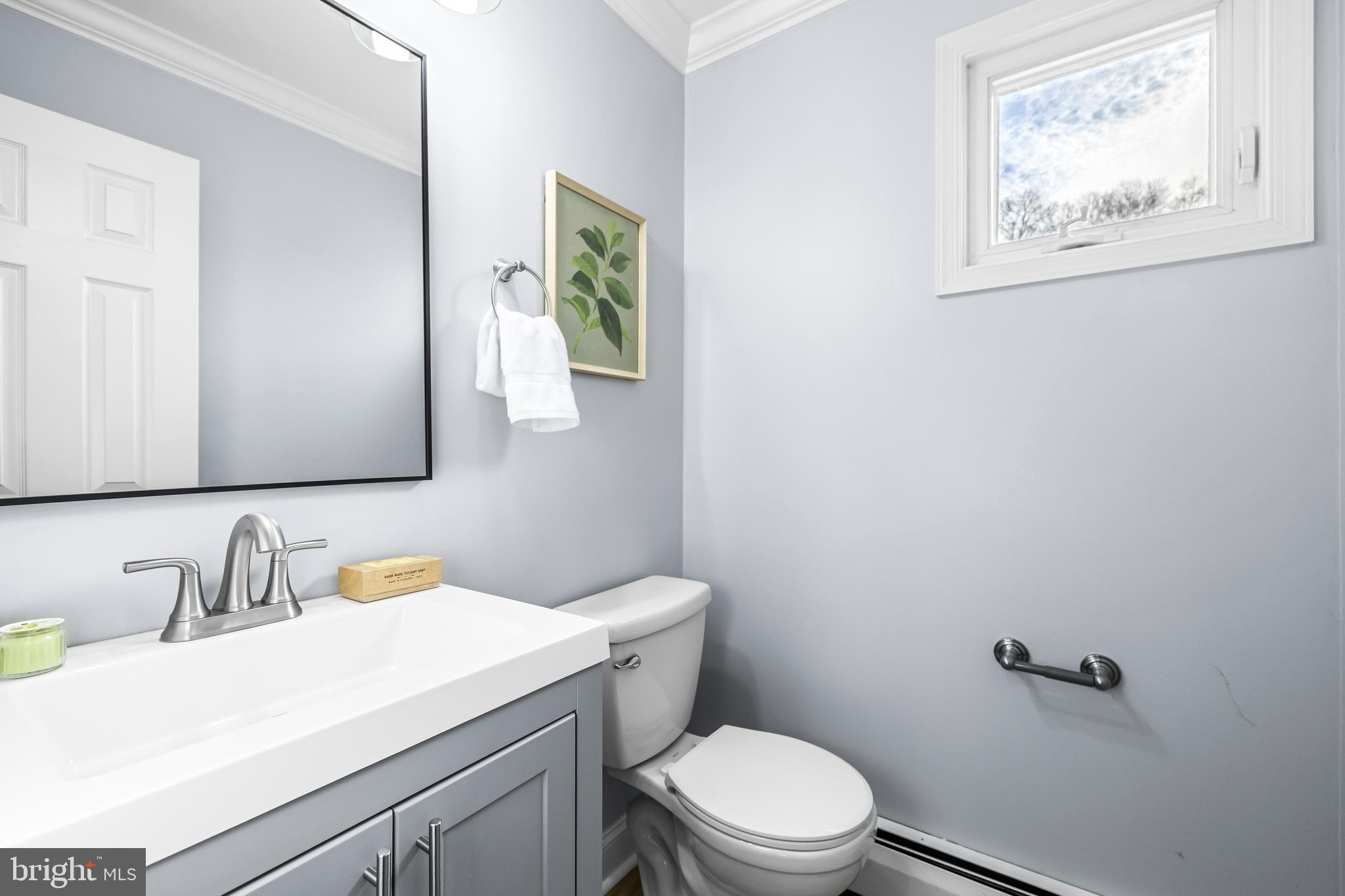 3533 Stansbury Mill Road Phoenix, MD 21131 - Photo 18 of 47 a bathroom with a toilet sink and mirror