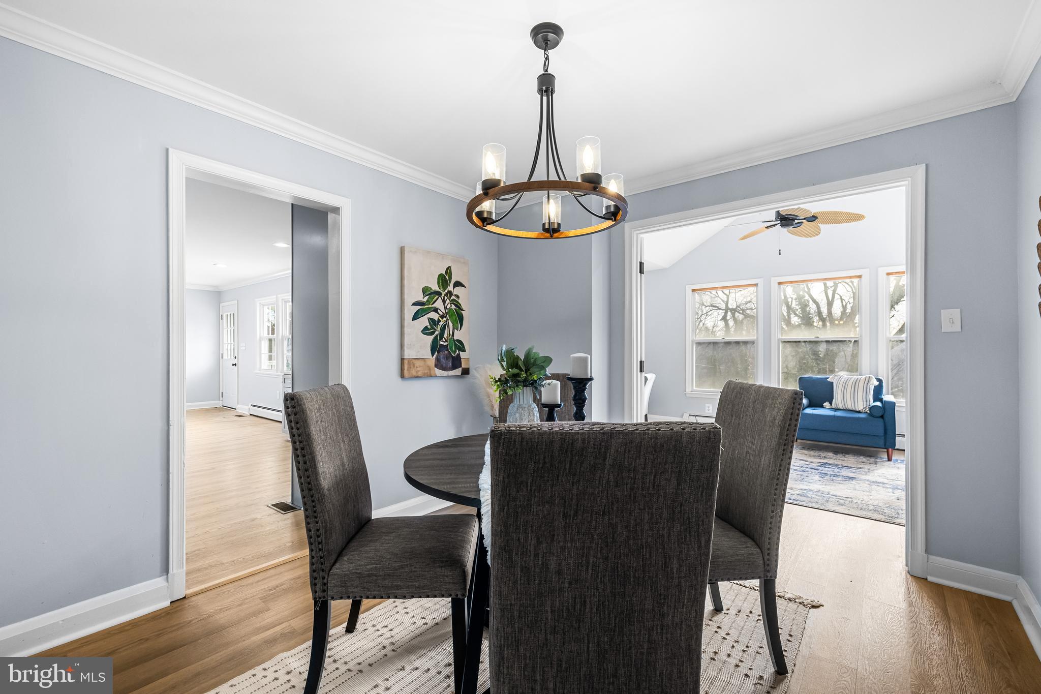 3533 Stansbury Mill Road Phoenix, MD 21131 - Photo 24 of 47 a dining room with furniture a chandelier and wooden floor