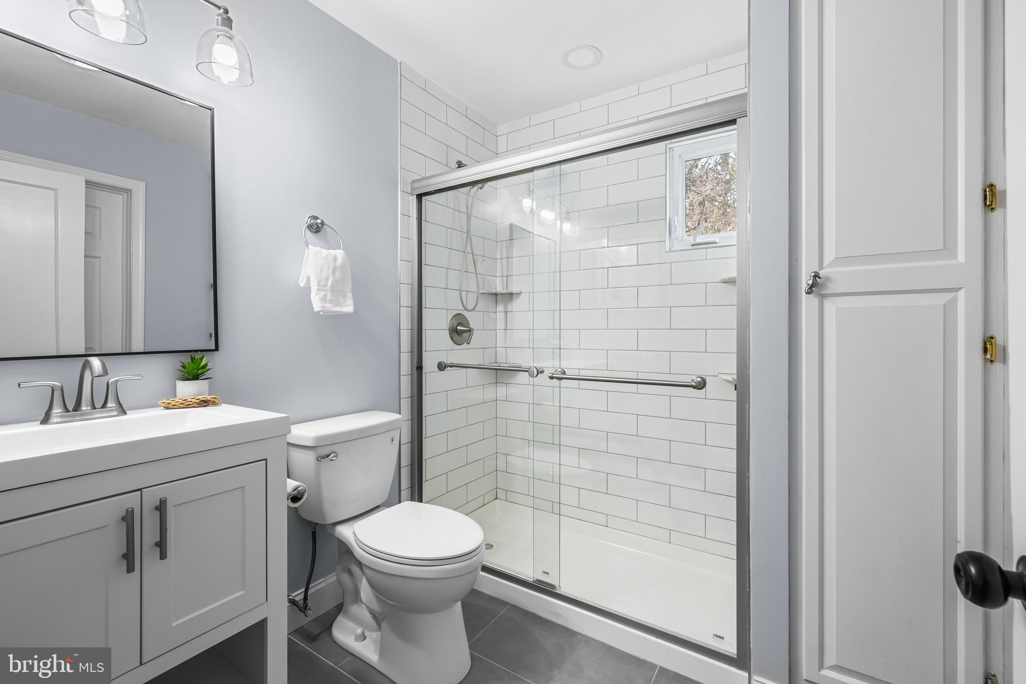 3533 Stansbury Mill Road Phoenix, MD 21131 - Photo 27 of 47 a bathroom with a toilet a sink and shower