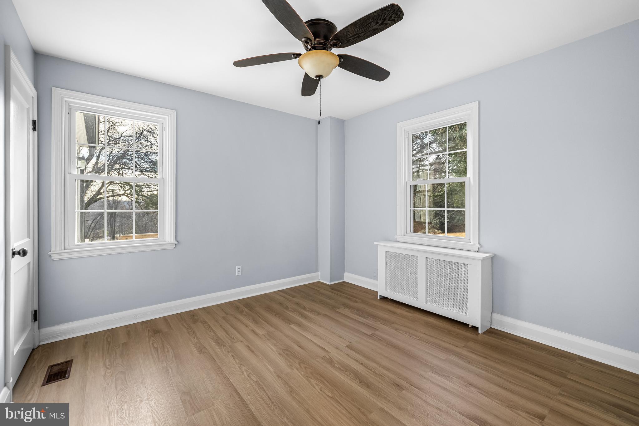 3533 Stansbury Mill Road Phoenix, MD 21131 - Photo 29 of 47 a view of an empty room with wooden floor and a window