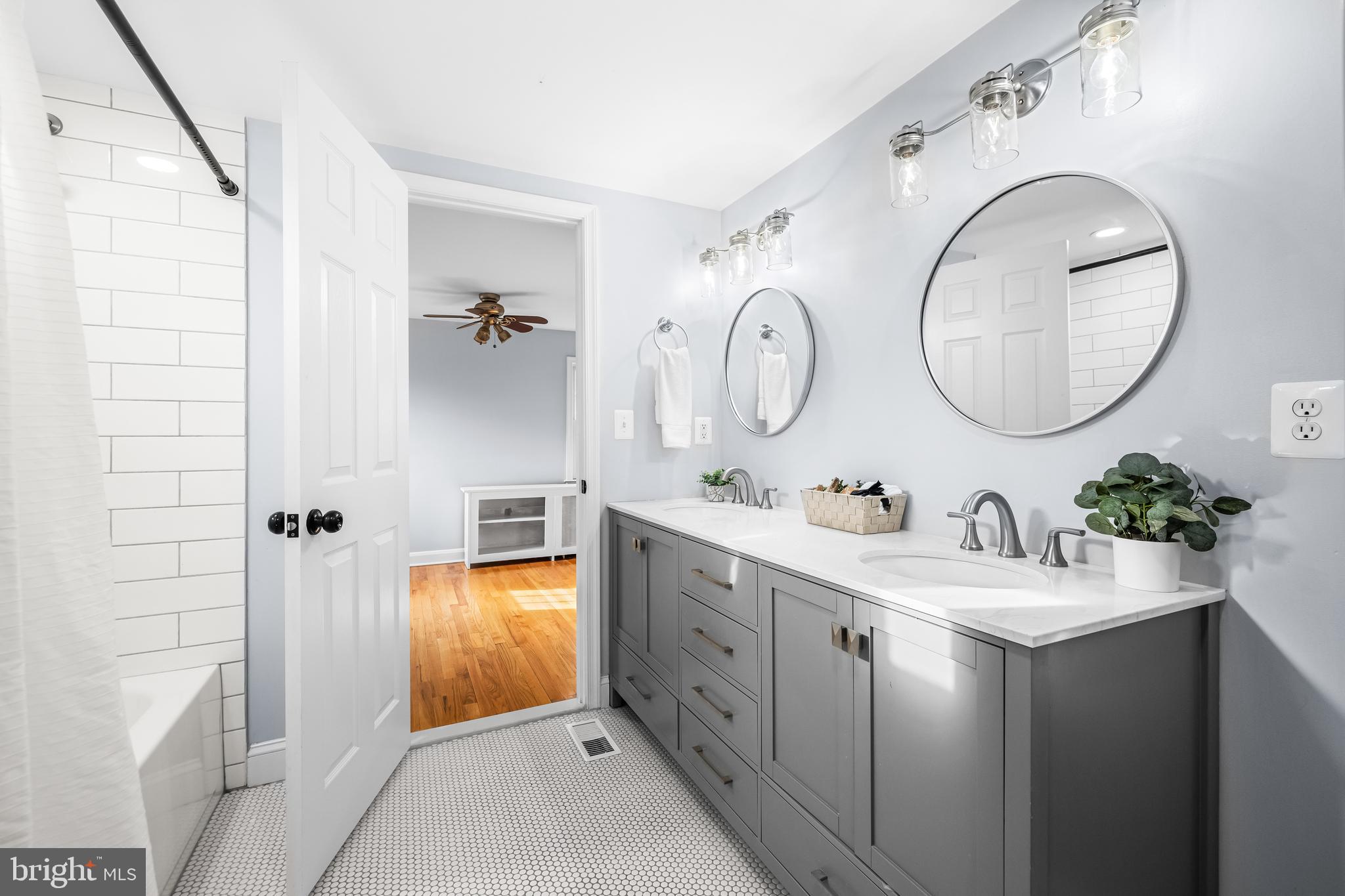 3533 Stansbury Mill Road Phoenix, MD 21131 - Photo 32 of 47 a bathroom with a double vanity sink and a mirror