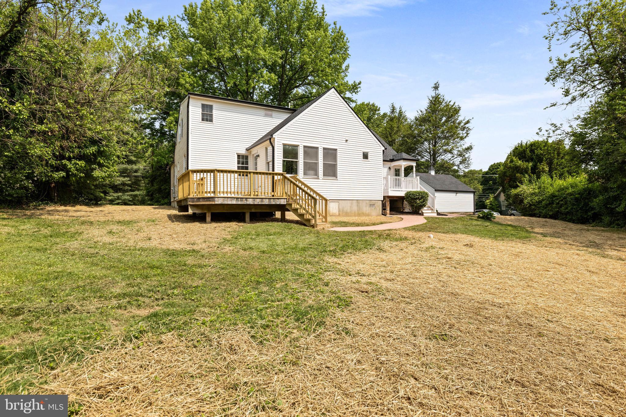 3533 Stansbury Mill Road Phoenix, MD 21131 - Photo 39 of 47 a view of a white house with a big yard and large trees