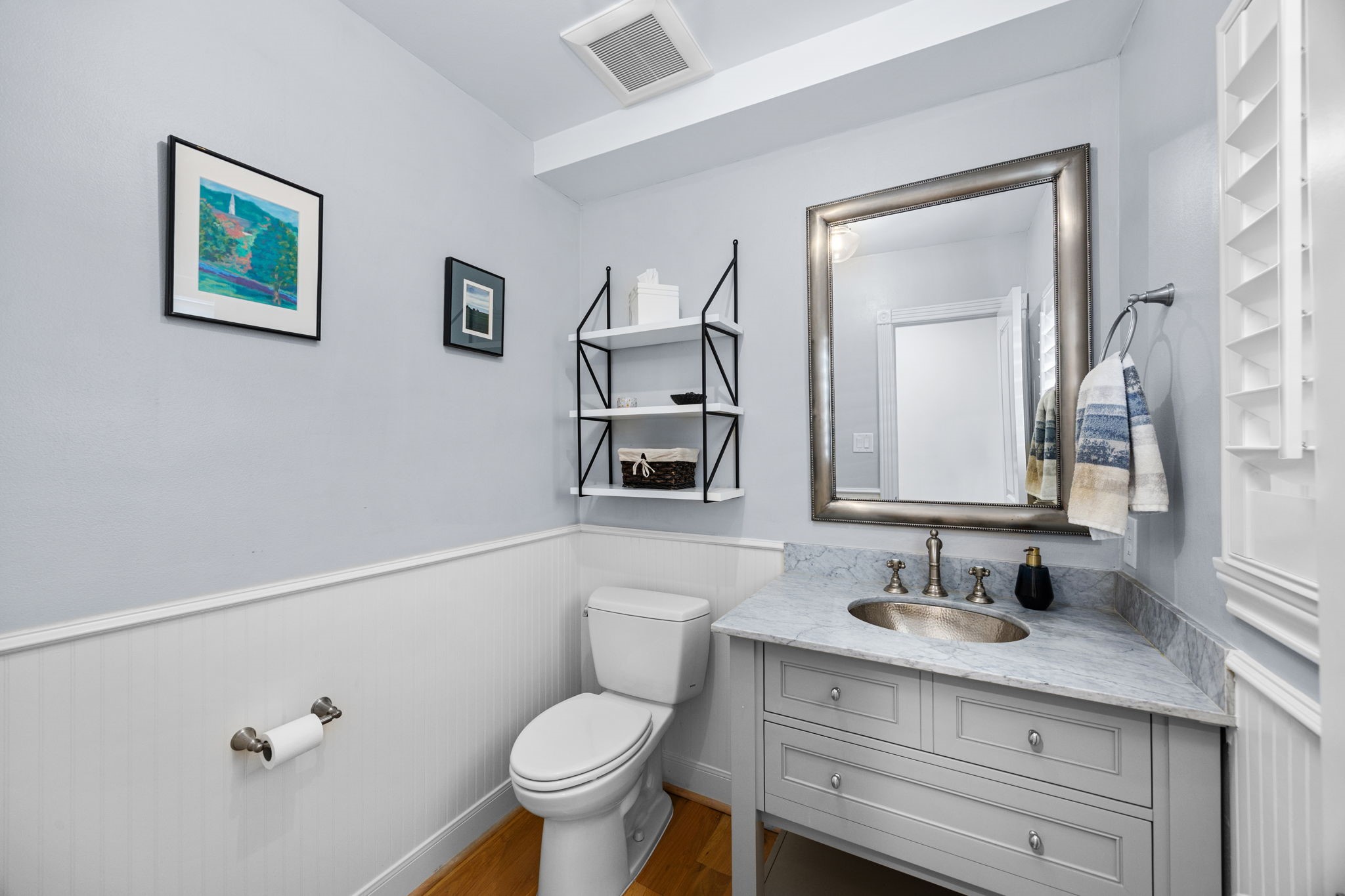 1741 Banks Street Houston, TX 77098 - Photo 20 of 50 a bathroom with a granite countertop sink mirror vanity and toilet