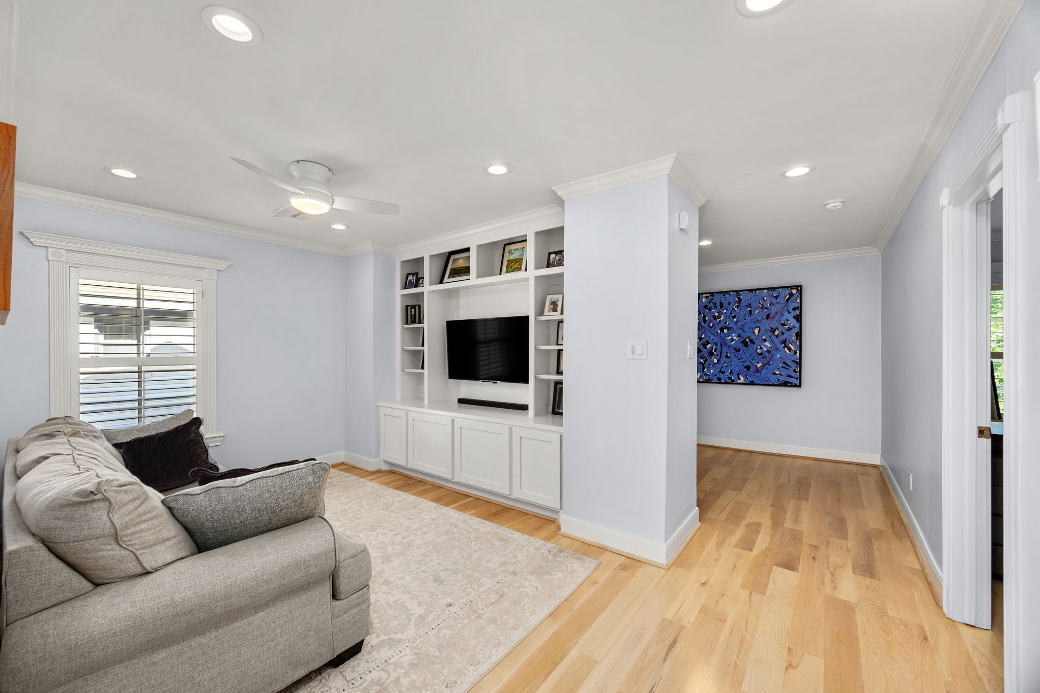 1741 Banks Street Houston, TX 77098 - Photo 23 of 50 a living room with furniture and a flat screen tv