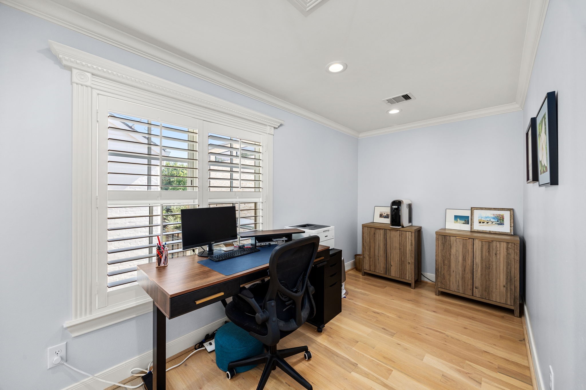 1741 Banks Street Houston, TX 77098 - Photo 31 of 50 a view of a workspace with furniture and a window