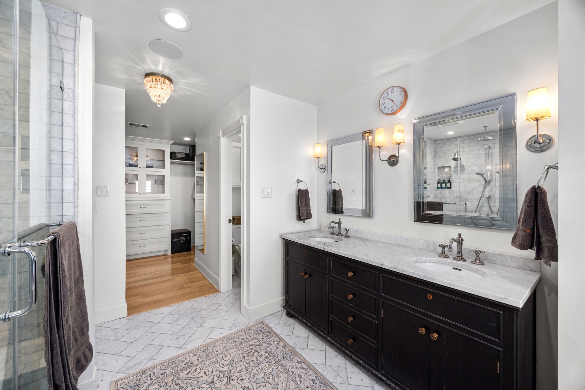 1741 Banks Street Houston, TX 77098 - Photo 37 of 50 a spacious bathroom with a shower sink and mirror
