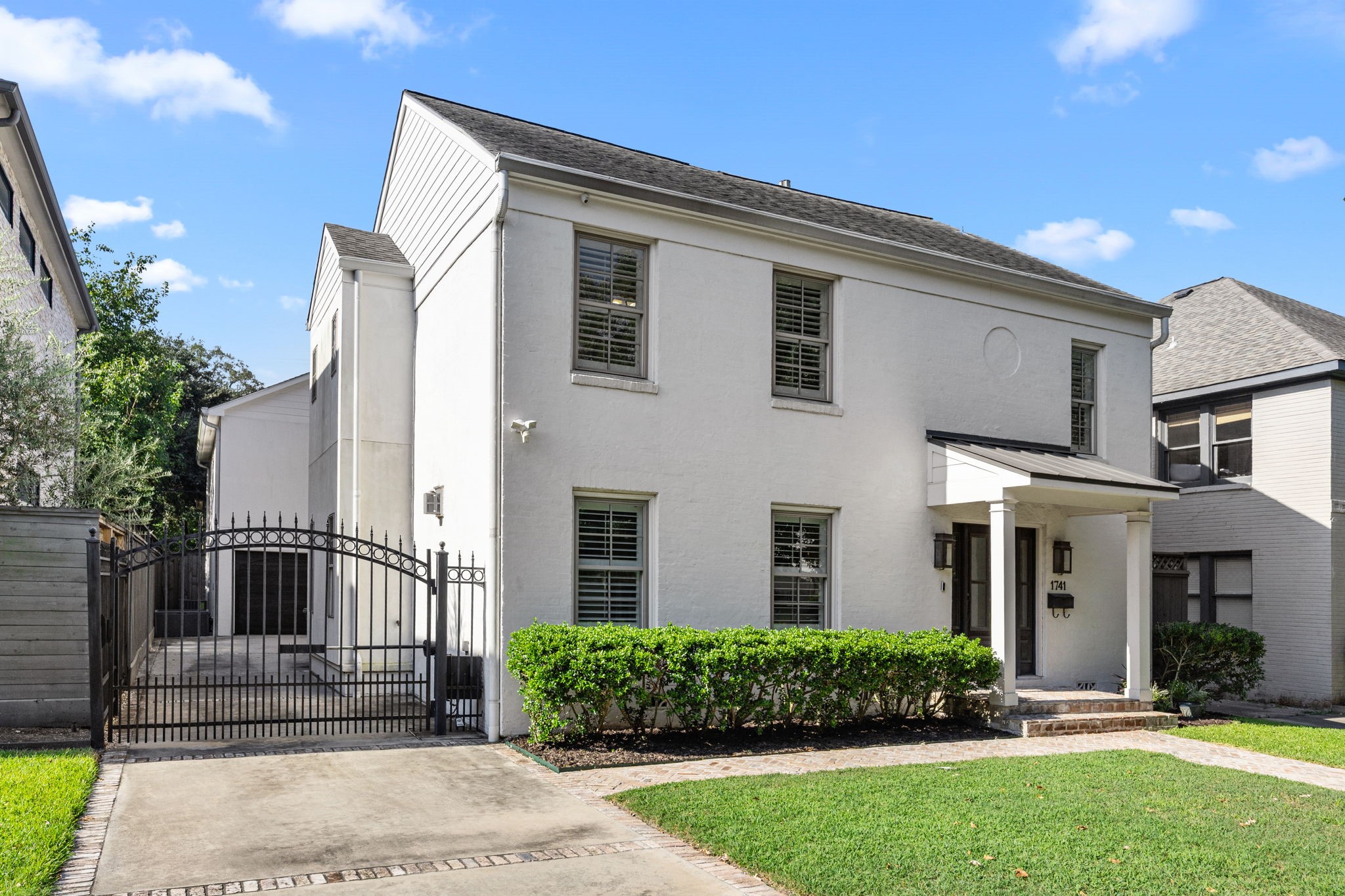 1741 Banks Street Houston, TX 77098 - Photo 4 of 50 a front view of a house with a yard