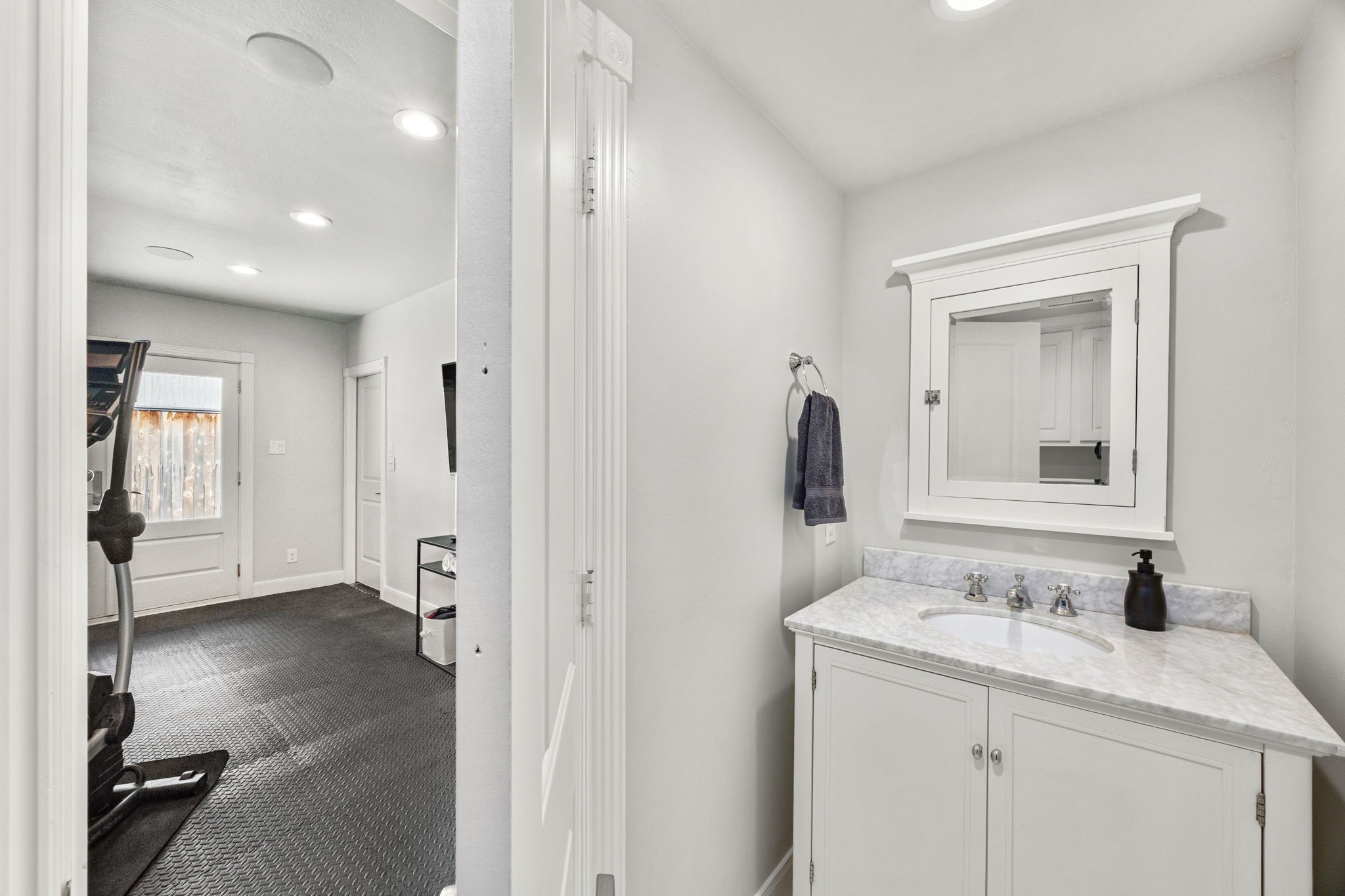 1741 Banks Street Houston, TX 77098 - Photo 40 of 50 a bathroom with a sink and a mirror