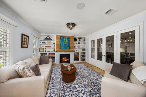a living room with furniture and a table