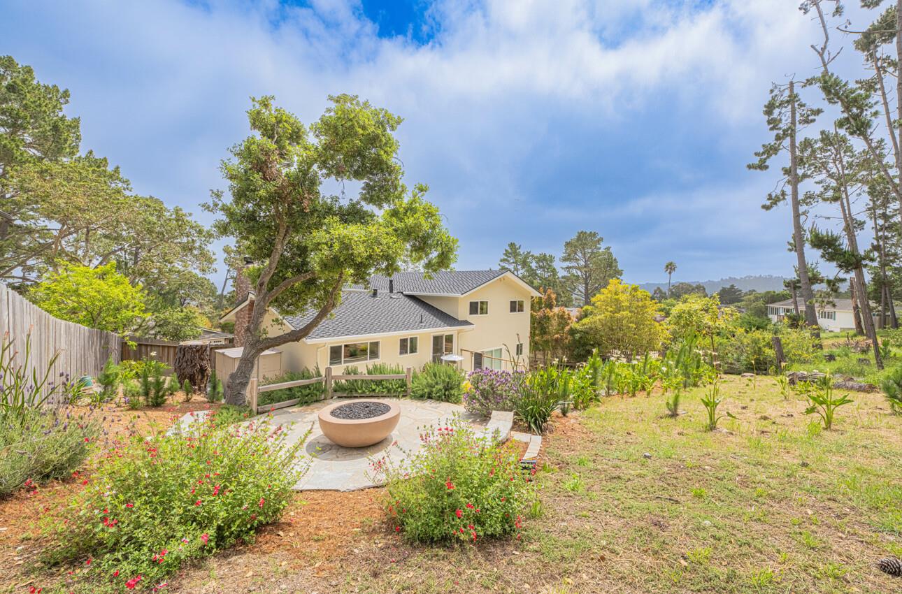 a view of a garden with a house
