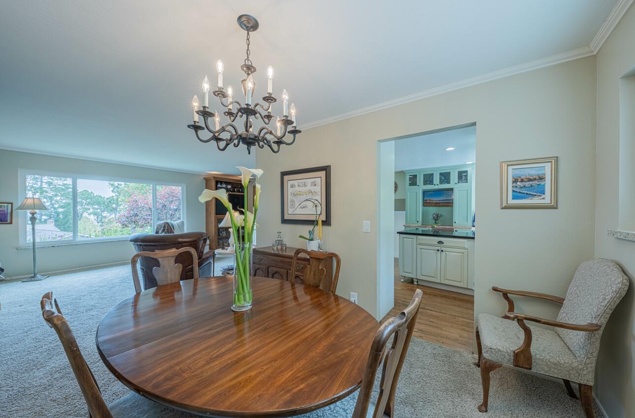 24 Pinehill Way Monterey, CA 93940 - Photo 16 of 51 a view of a dining room with furniture wooden floor and chandelier