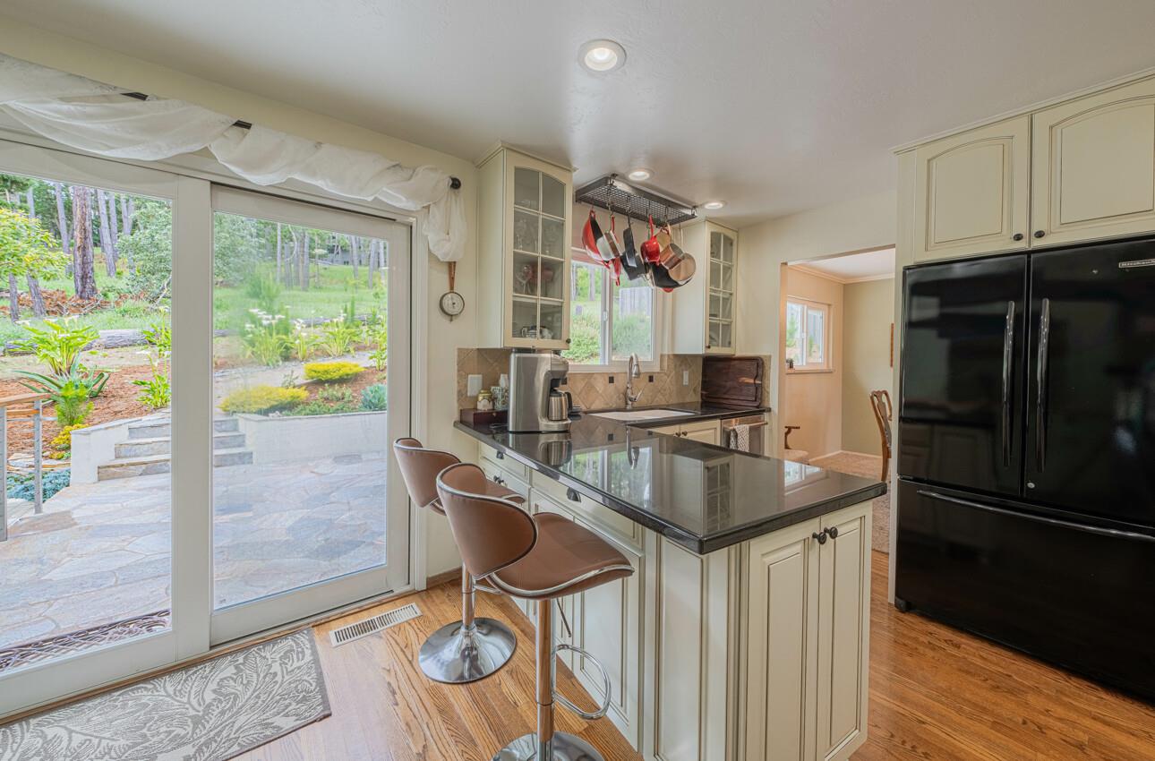 24 Pinehill Way Monterey, CA 93940 - Photo 17 of 51 a kitchen with granite countertop a sink and a refrigerator