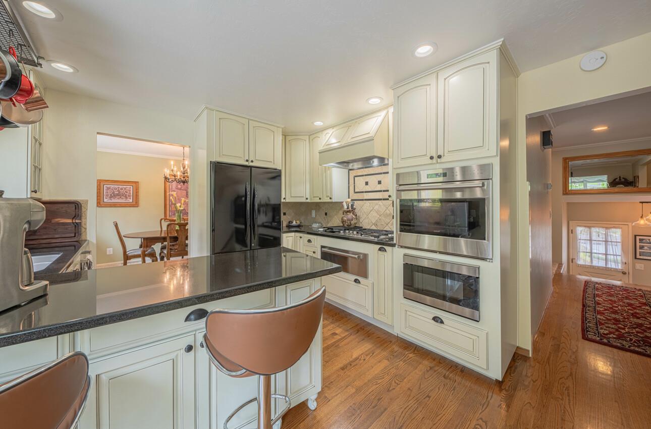 24 Pinehill Way Monterey, CA 93940 - Photo 18 of 51 a kitchen with stainless steel appliances granite countertop a stove a sink and a refrigerator
