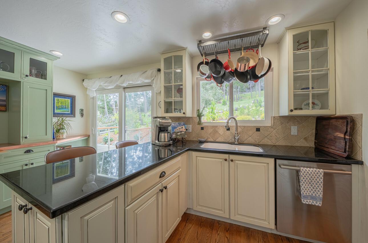 24 Pinehill Way Monterey, CA 93940 - Photo 19 of 51 a kitchen with a sink window and cabinets