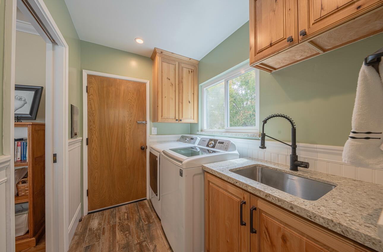 24 Pinehill Way Monterey, CA 93940 - Photo 25 of 51 a view of a sink and dishwasher with wooden floor