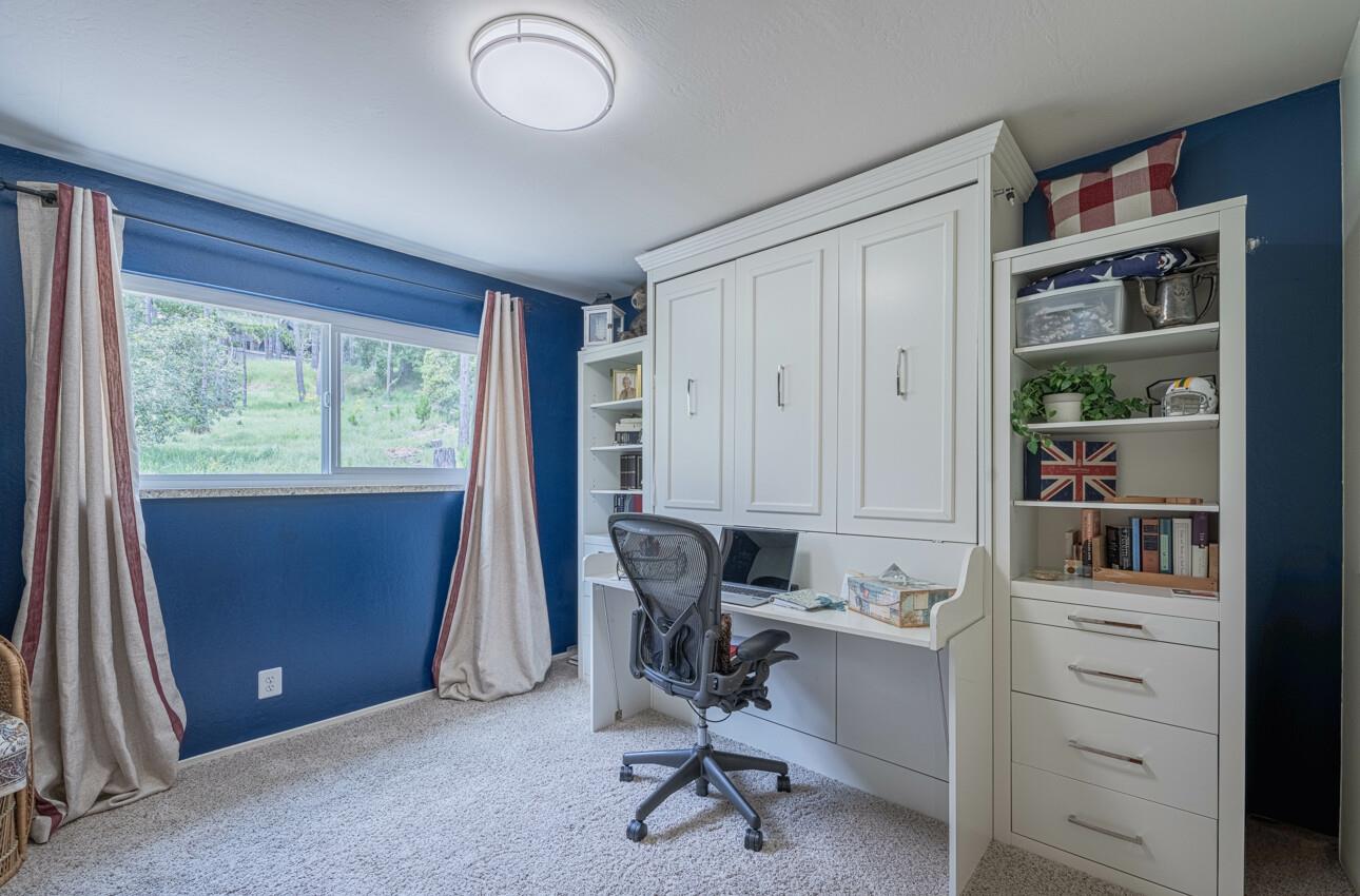 24 Pinehill Way Monterey, CA 93940 - Photo 28 of 51 a view of a workspace with furniture and a window