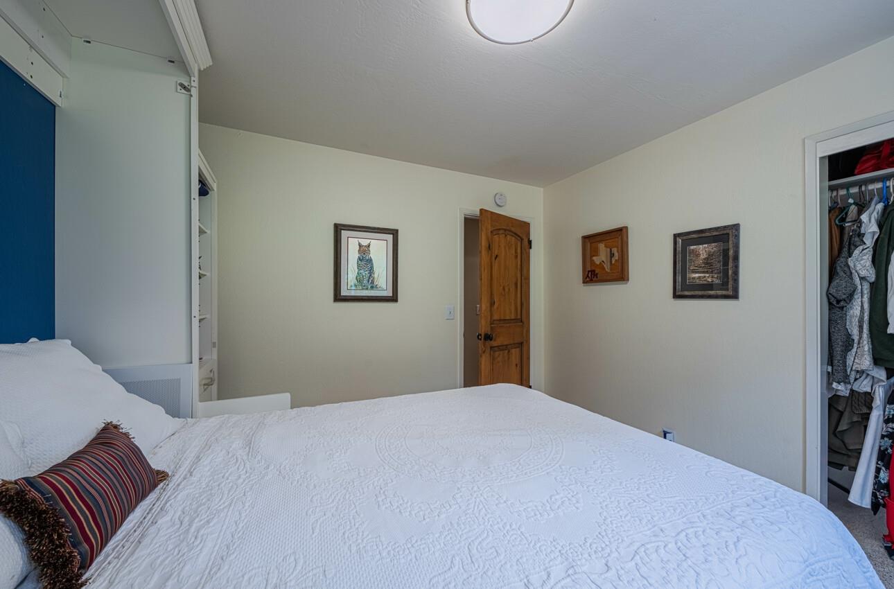 24 Pinehill Way Monterey, CA 93940 - Photo 30 of 51 a bedroom with a bed and a window