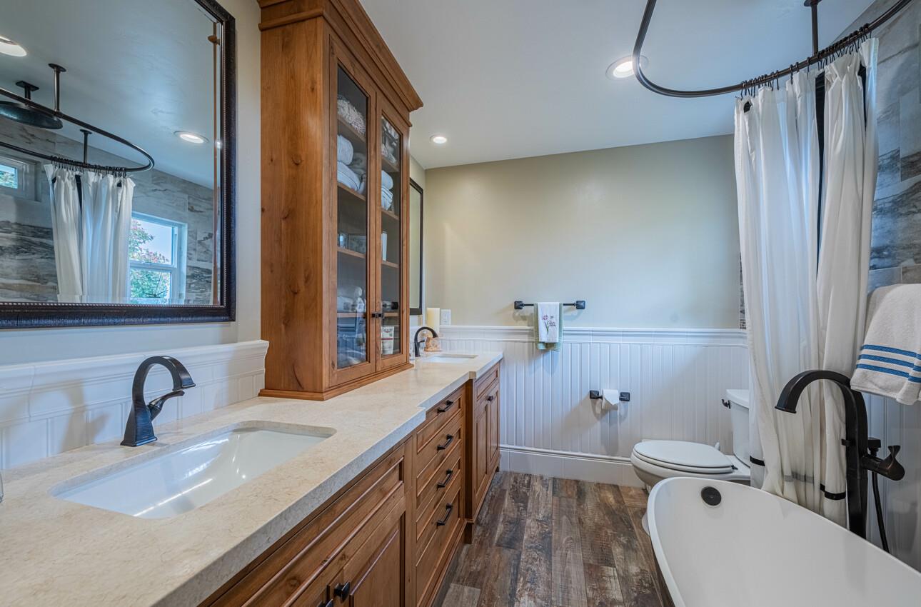 24 Pinehill Way Monterey, CA 93940 - Photo 33 of 51 a bathroom with a double vanity sink a toilet and a mirror