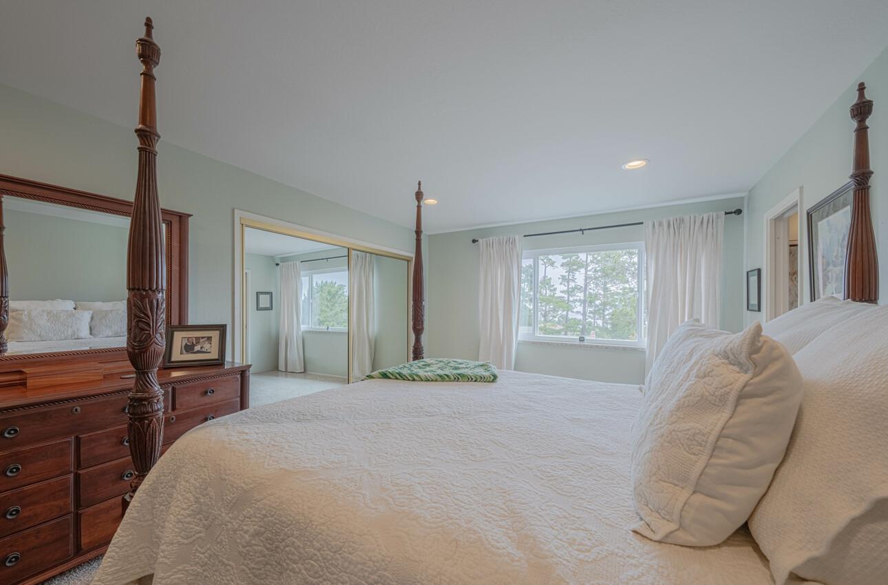 24 Pinehill Way Monterey, CA 93940 - Photo 38 of 51 a spacious bedroom with a large bed and a dresser