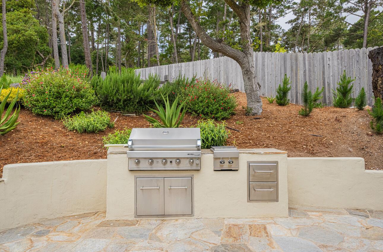 24 Pinehill Way Monterey, CA 93940 - Photo 44 of 51 a backyard with a table and chairs