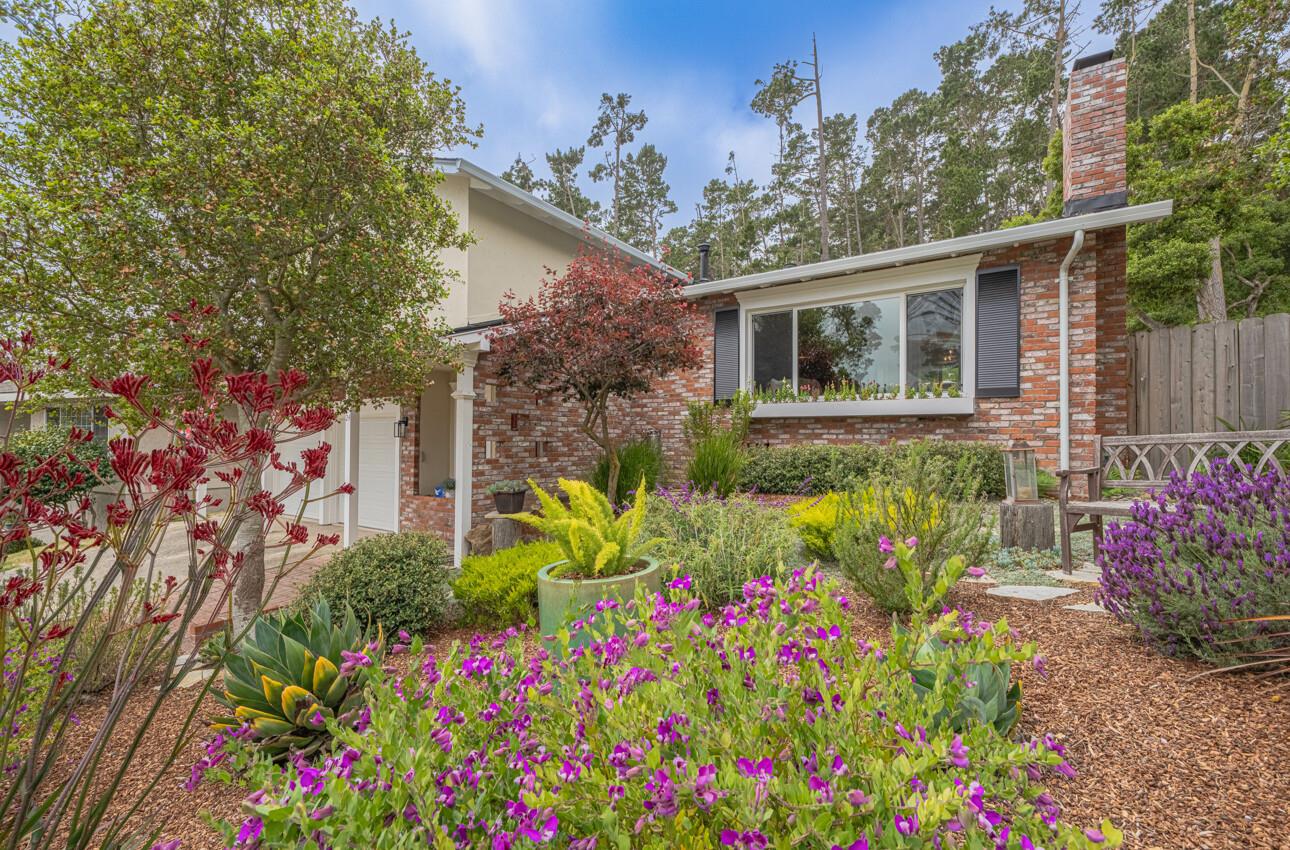 24 Pinehill Way Monterey, CA 93940 - Photo 5 of 51 a flower garden in front of a house