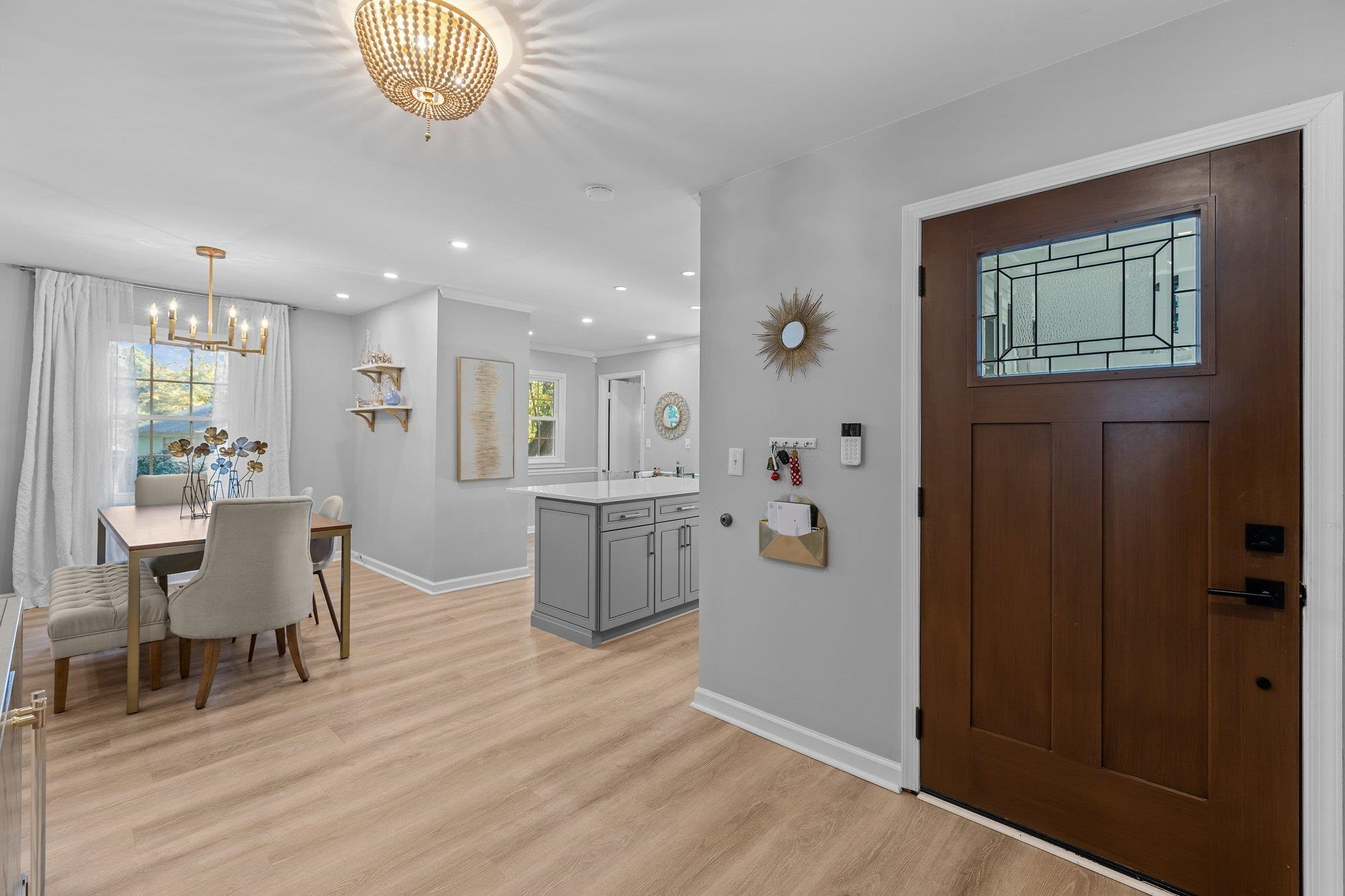 3604 Morningside Drive Raleigh, NC 27607 - Photo 7 of 38 a view of a dining room with furniture a chandelier and wooden floor
