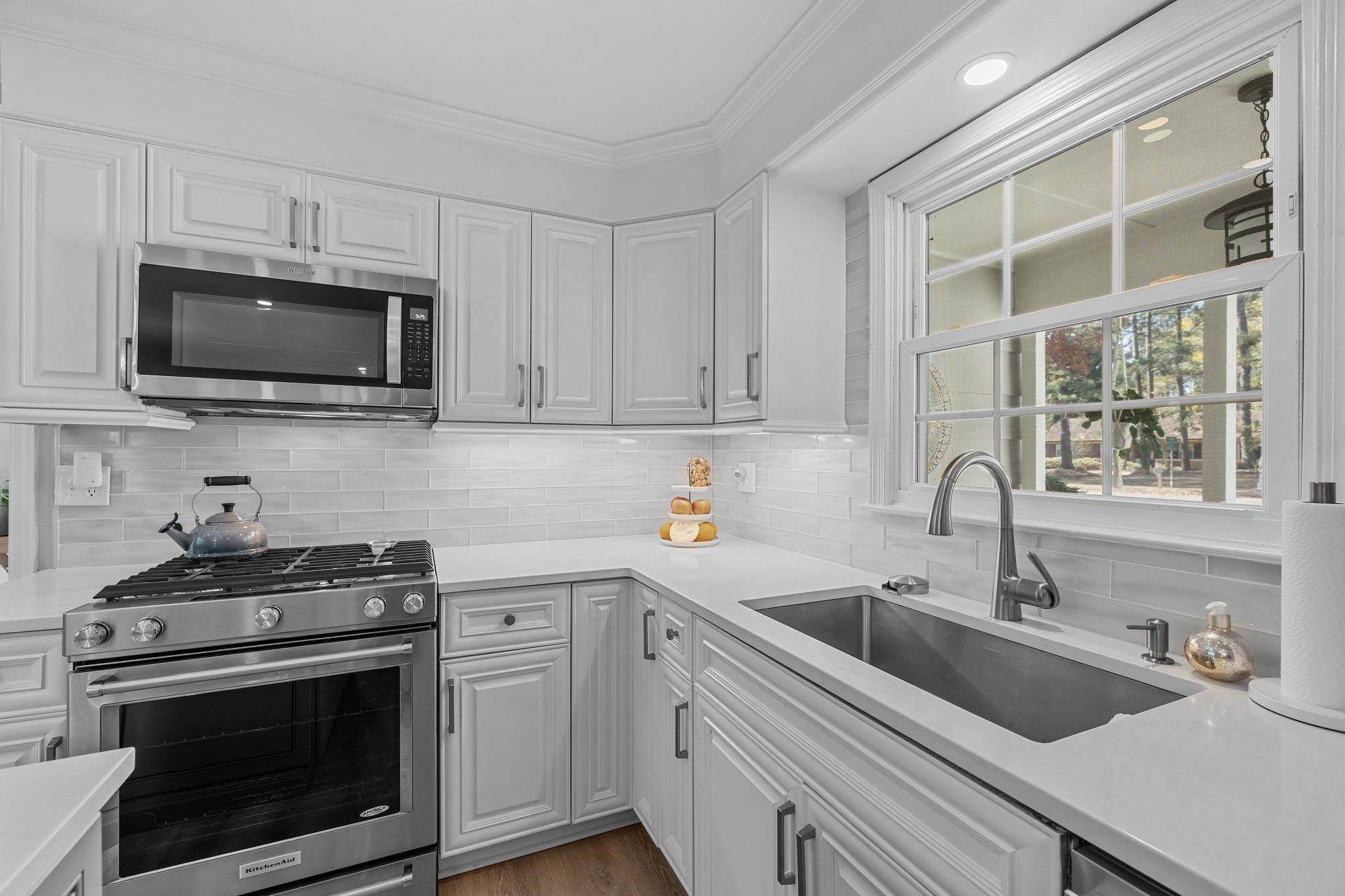 3604 Morningside Drive Raleigh, NC 27607 - Photo 10 of 38 a kitchen with a sink stove and microwave