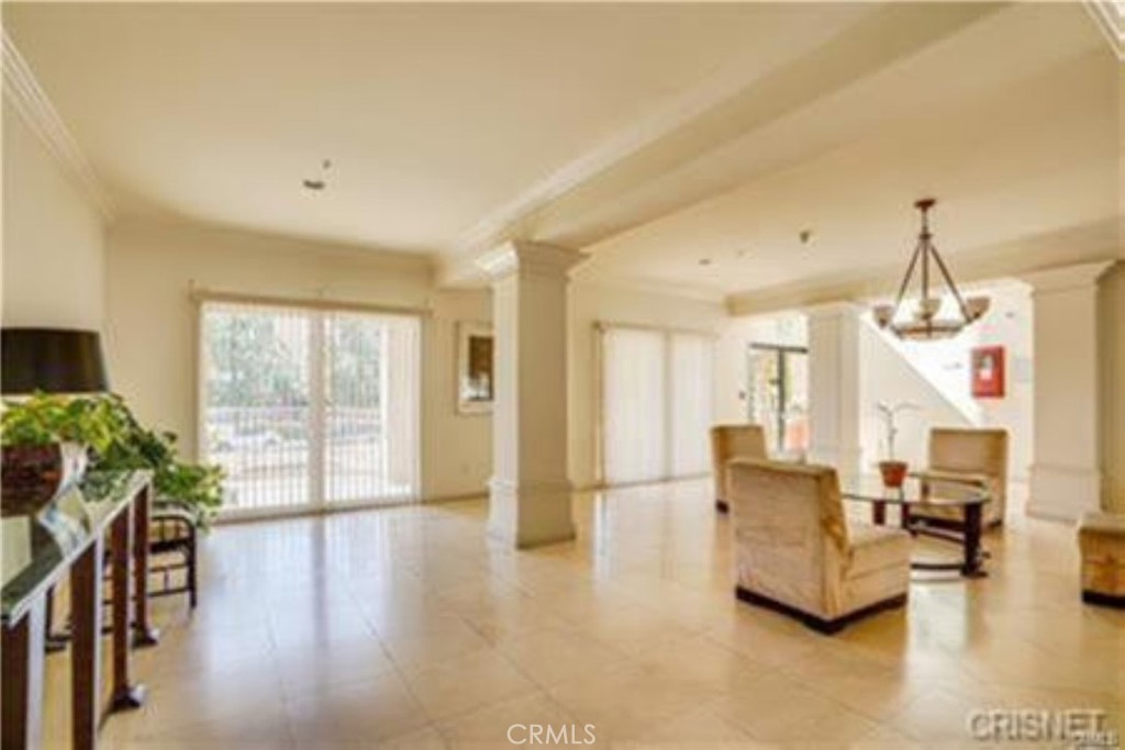 9610 Zelzah Avenue, Unit 310 Northridge, CA 91325 - Photo 19 of 32 a living room with furniture and wooden floor