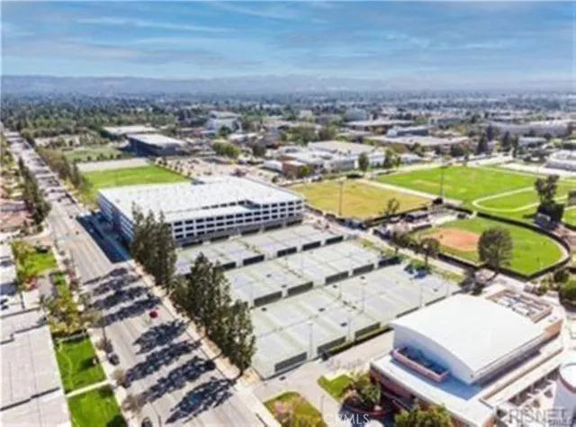 an aerial view of a house with a ocean view