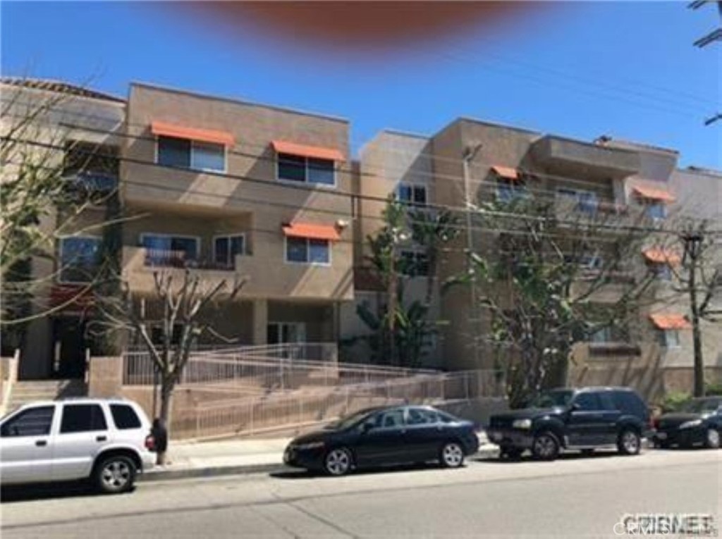 9610 Zelzah Avenue, Unit 310 Northridge, CA 91325 - Photo 3 of 32 a car parked in front of a building