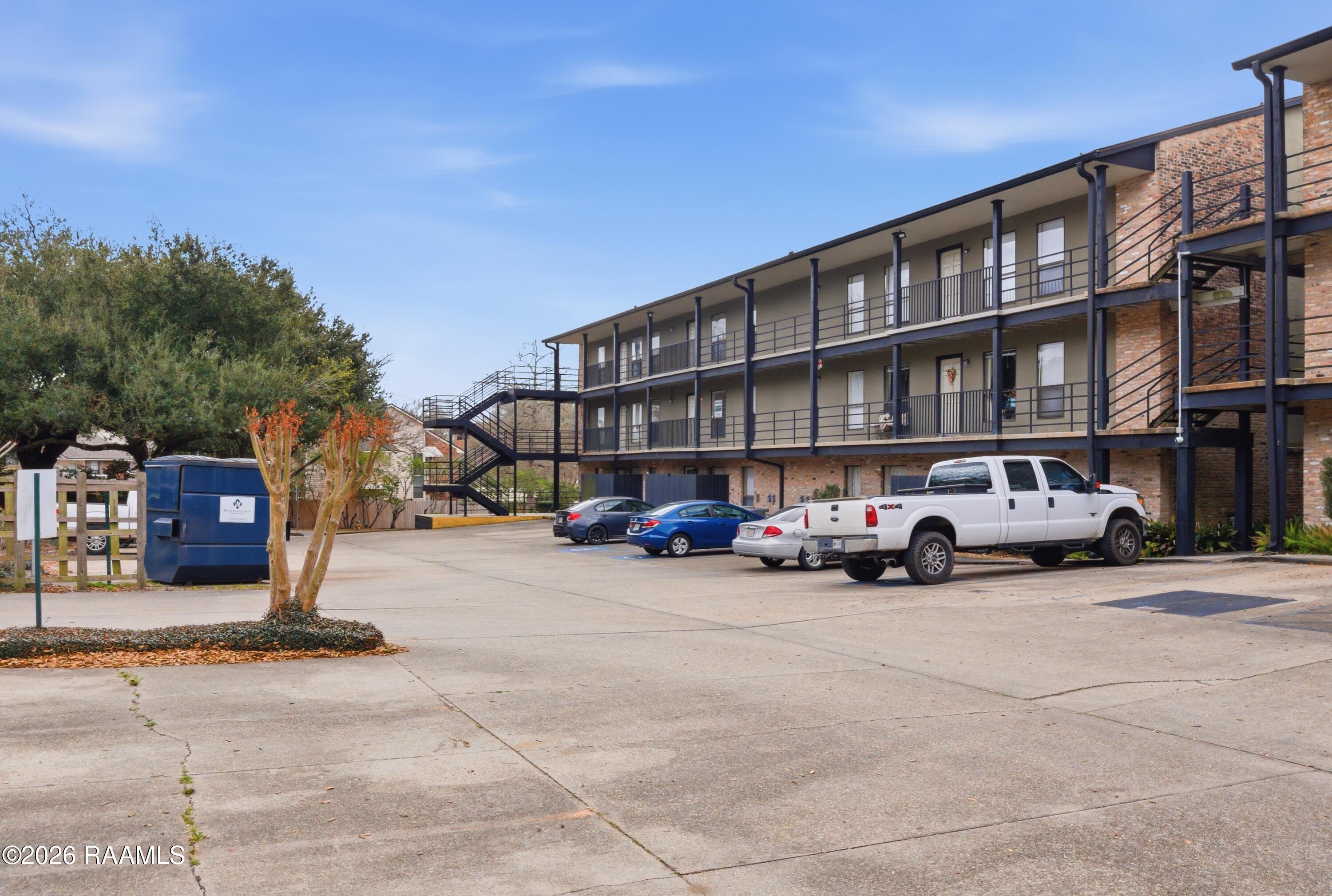 701 South College Road, Unit 307 Lafayette, LA 70503 - Photo 12 of 12 Back Parking Lot