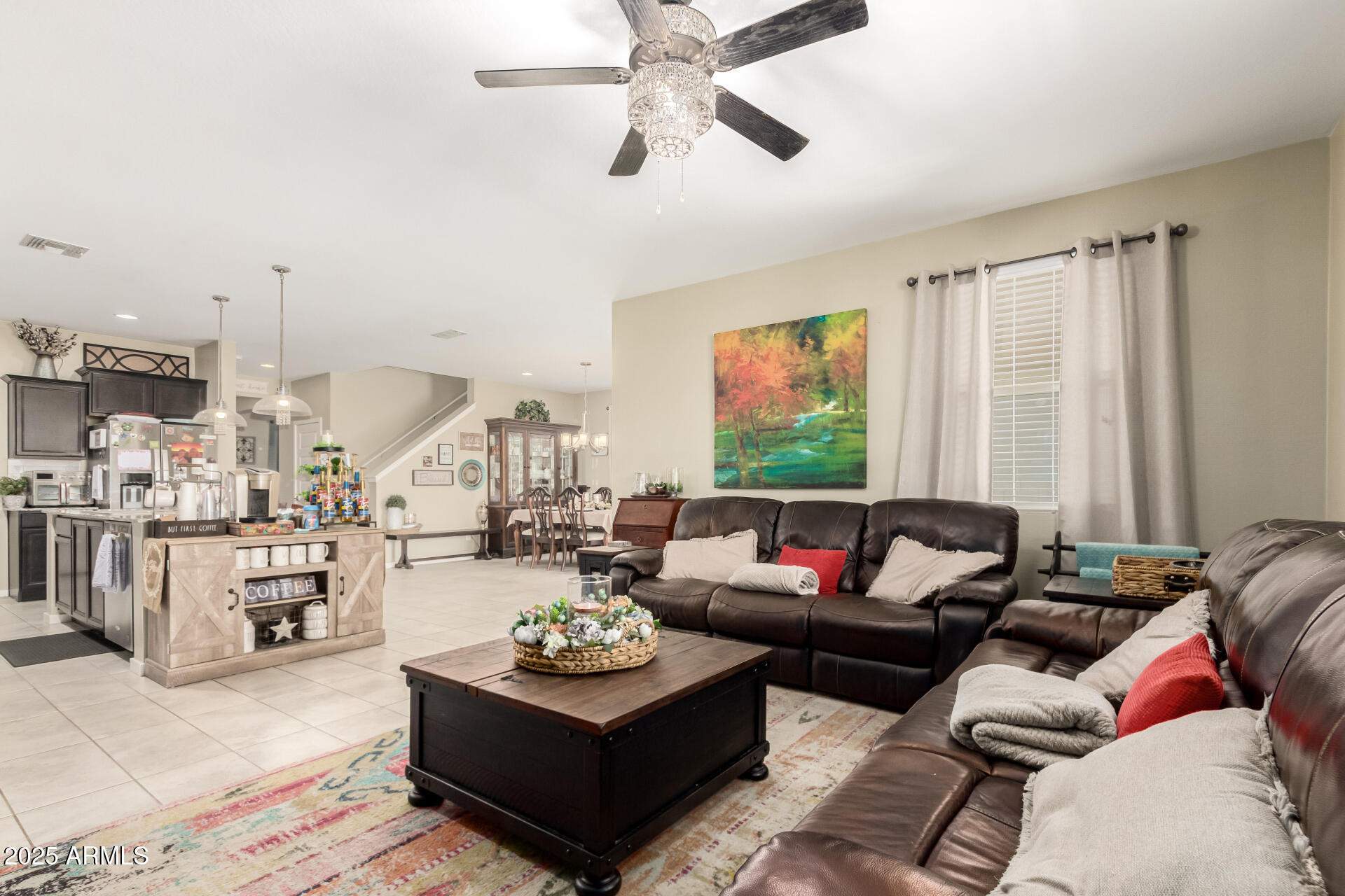 40098 West Ganly Way Maricopa, AZ 85138 - Photo 11 of 46 a living room with furniture and a large window