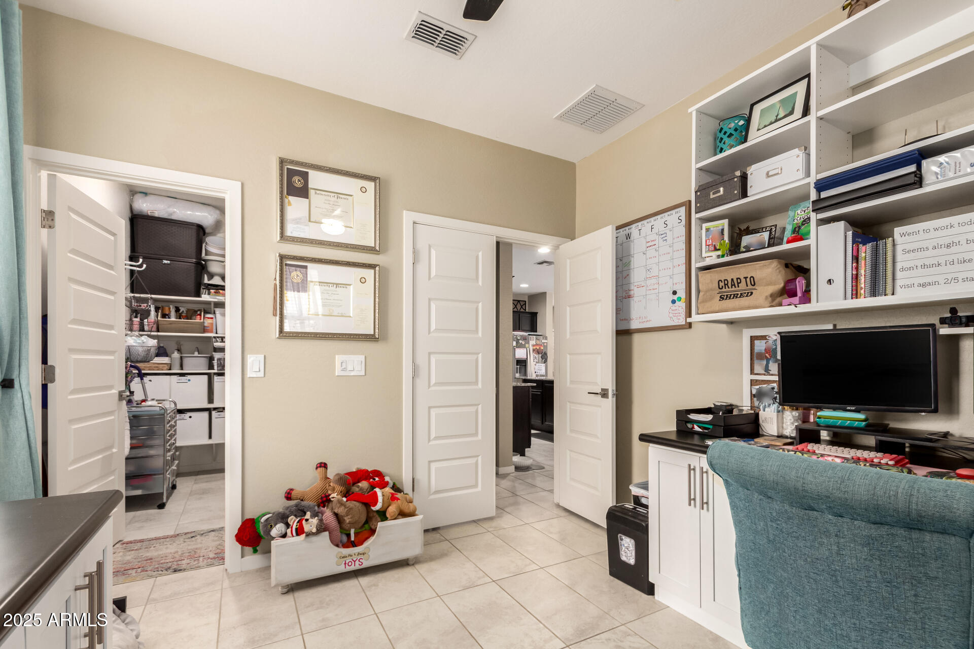 40098 West Ganly Way Maricopa, AZ 85138 - Photo 19 of 46 a living room with furniture and a flat screen tv