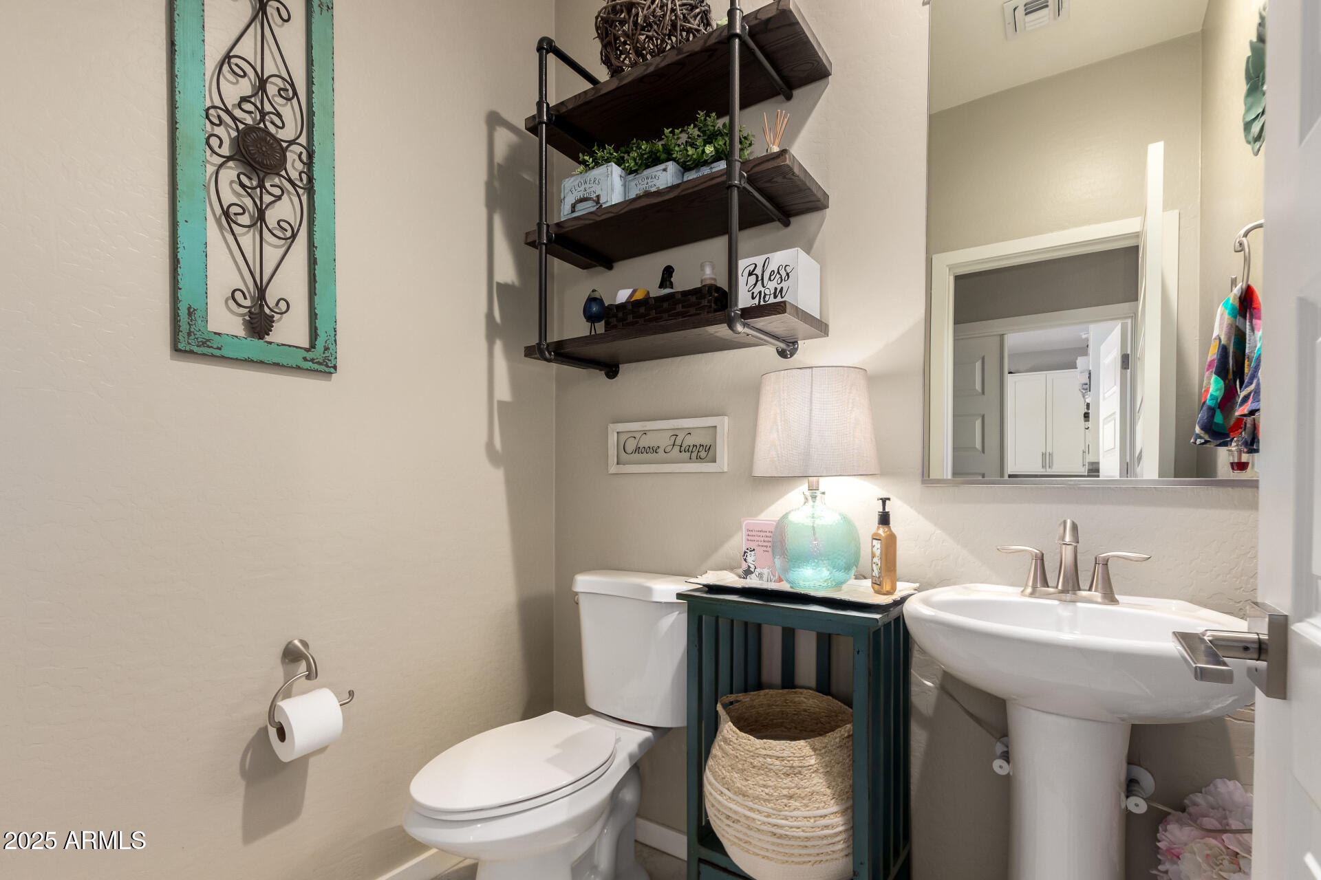 40098 West Ganly Way Maricopa, AZ 85138 - Photo 21 of 46 a bathroom with a toilet sink and mirror