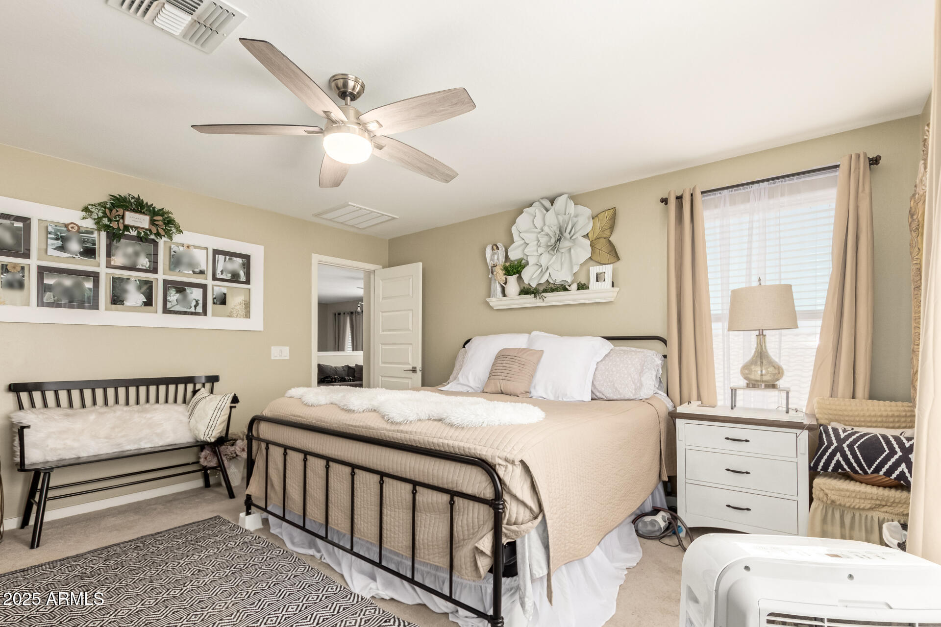 40098 West Ganly Way Maricopa, AZ 85138 - Photo 26 of 46 a bedroom with a bed and a window
