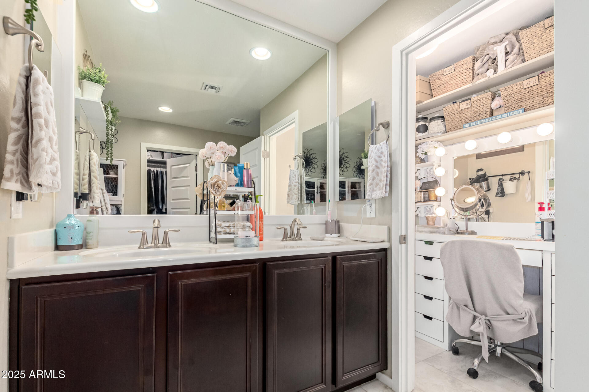 40098 West Ganly Way Maricopa, AZ 85138 - Photo 27 of 46 a bathroom with a double vanity sink and a mirror