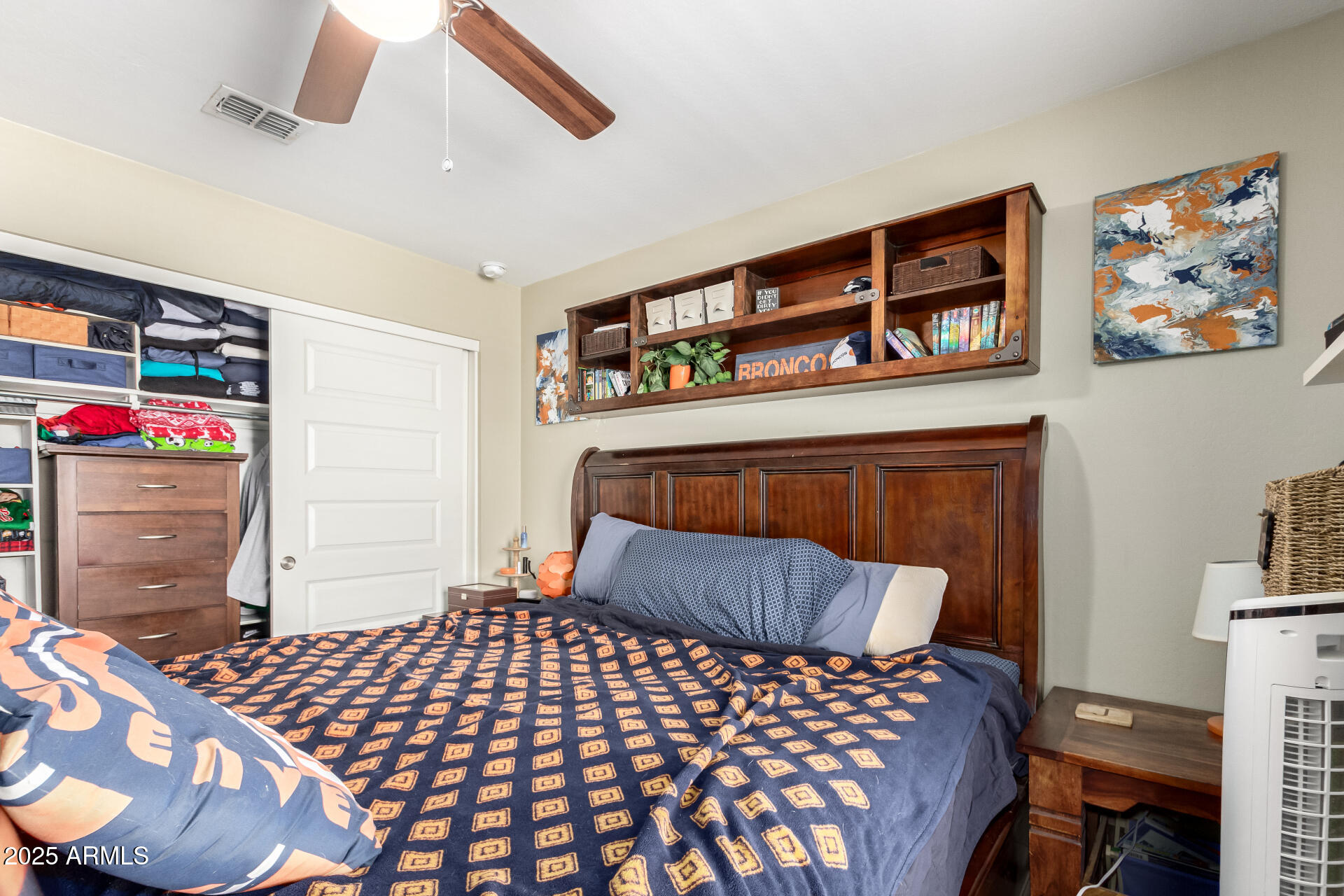 40098 West Ganly Way Maricopa, AZ 85138 - Photo 34 of 46 a bedroom with a bed and wooden floor