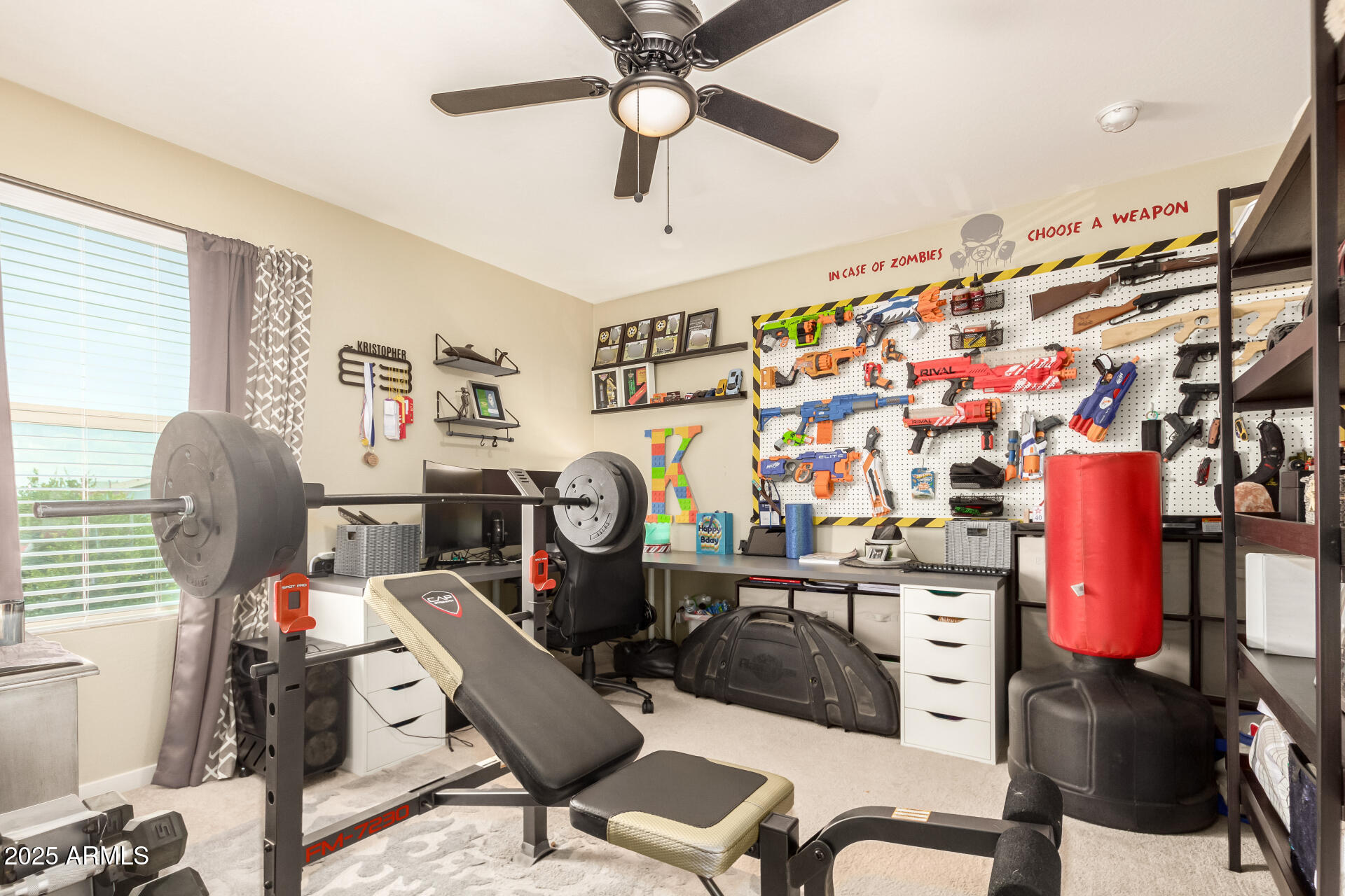 40098 West Ganly Way Maricopa, AZ 85138 - Photo 35 of 46 a view of a workspace with furniture and a window