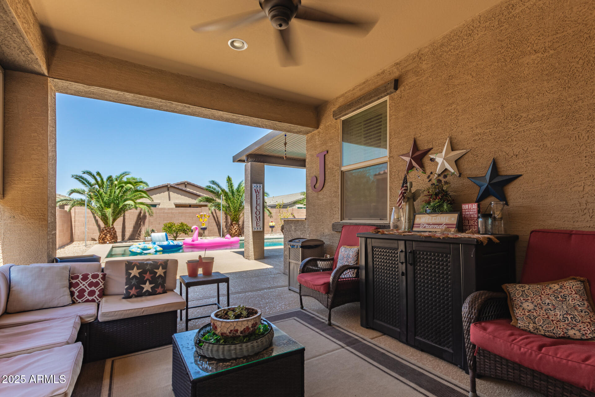 40098 West Ganly Way Maricopa, AZ 85138 - Photo 40 of 46 a living room with furniture and a potted plant