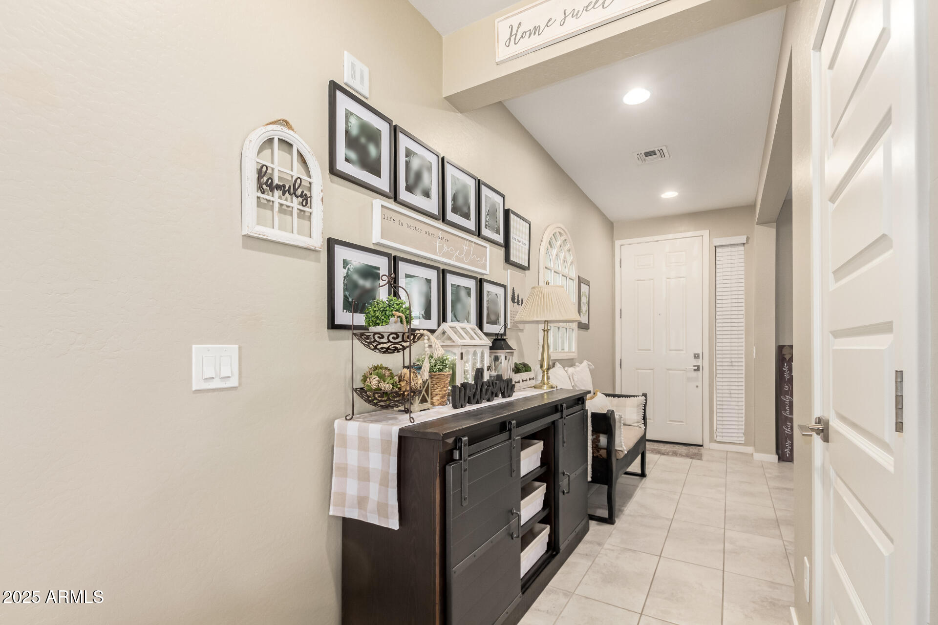 40098 West Ganly Way Maricopa, AZ 85138 - Photo 9 of 46 a hallway with a sink and cabinets