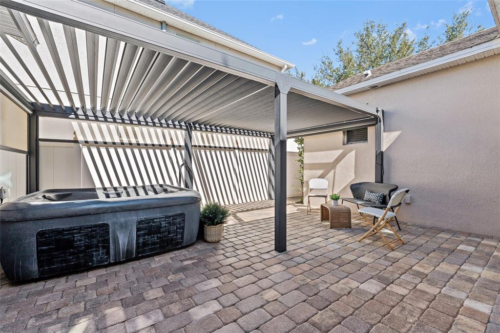 7935 Winter Wren Street Winter Garden, FL 34787 - Photo 26 of 36 a view of a patio with a table and chairs
