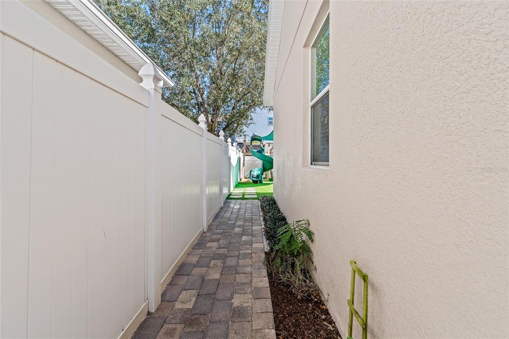 7935 Winter Wren Street Winter Garden, FL 34787 - Photo 29 of 36 a view of a pathway both side of a house