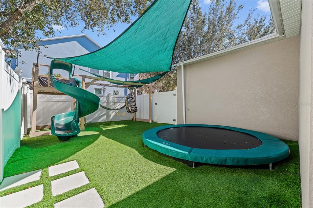 7935 Winter Wren Street Winter Garden, FL 34787 - Photo 30 of 36 a view of a backyard with a tub