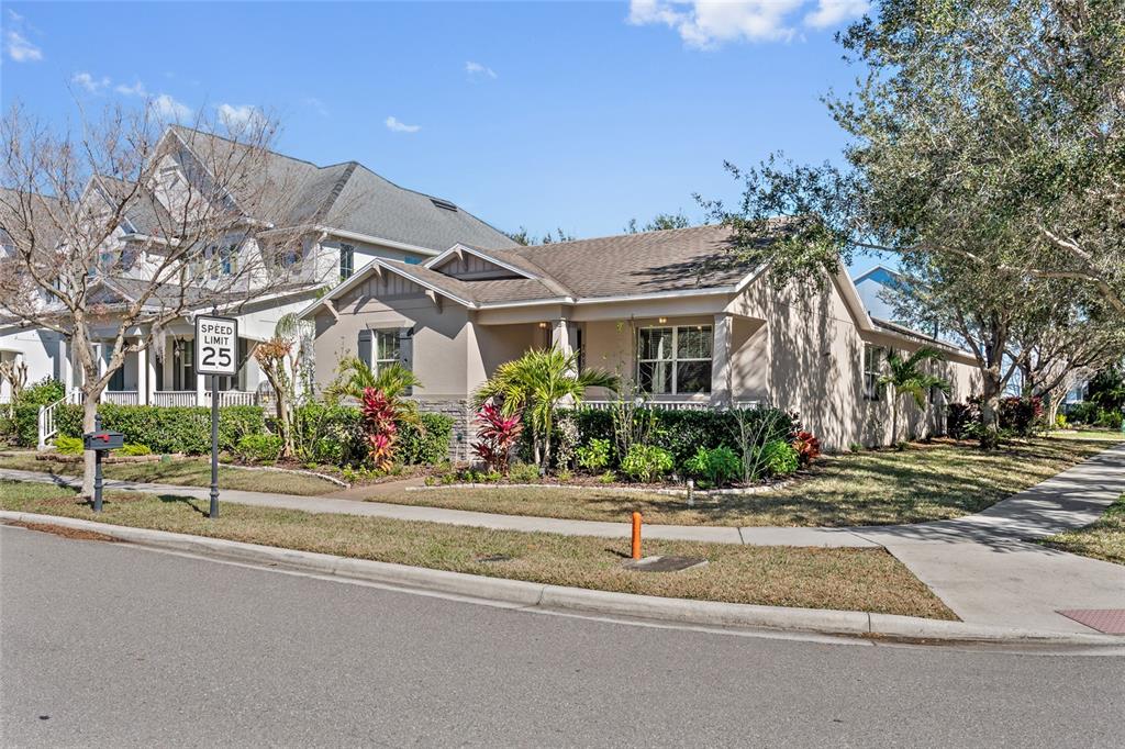 7935 Winter Wren Street Winter Garden, FL 34787 - Photo 3 of 36 a front view of a house with a garden