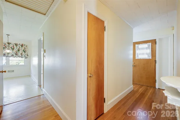 a view of a bathroom from a hallway