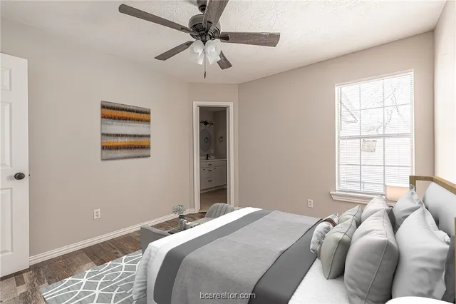 a bedroom with a bed and a window