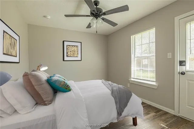 a bedroom with a bed and a window